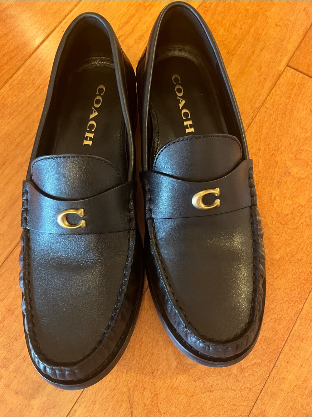 Coach black leather penny loafers